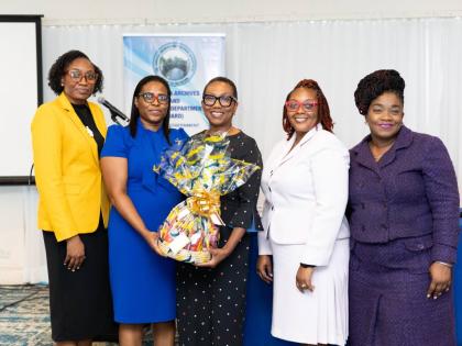 British High Commissioner to Jamaica Alicia Herbert (centre) with (from left) Ketanya Laing, acting government archivist, Jamaica Archives and Records Department (JARD); Princess Gordon‑Commock, senior archivist, audio‑visual unit, JARD; Racquel Stratc
