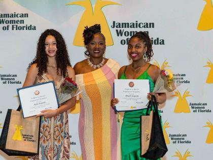 Michelle Williamson, outgoing JWOF president, is flanked by student awardees, Kylin Reynolds (left) and Abigail Jacquette.