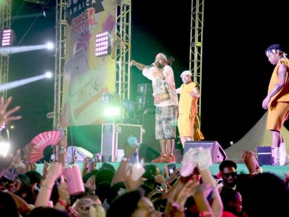 Soca artiste Machel Montano (centre) and the Monk Dancers keep the energy high at I Love Soca Jamaica on Friday morning.