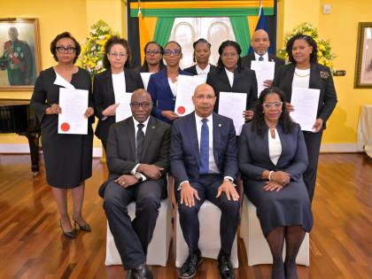 Governor-General Sir Patrick Allen (seated, centre); Chief Justice Bryan Sykes (seated, left) and President of the Court of Appeal, Justice Marva McDonald-Bishop (seated, right) share a photo with the eight members of the judiciary who were sworn into high