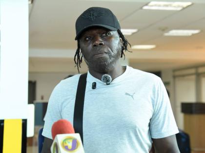 Garth Smythe,  Shanoya Douglas’ coach. 