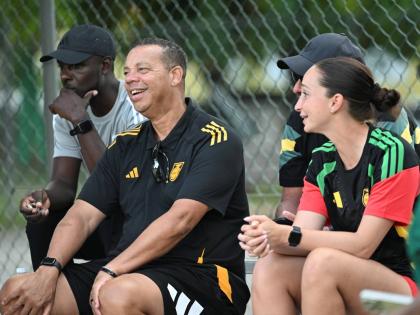 
National Women’s coach Hubert Busby Jr with his coaching staff at the Jamaica Women’s Premier league encounter between Cavalier and UWI at the Alpha Institute yesterday.