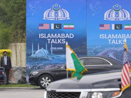 A Pakistani official is seen during the arrival of the US Vice President JD Vance for talks with Iranian officials in Islamabad.