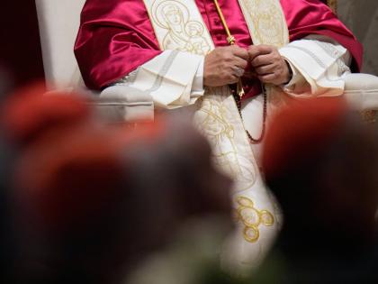 Pope Leo XIV holds a rosary as he leads a vigil for peace inside St. Peter’s Basilica at the Vatican.