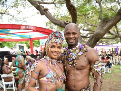 Joining the road vibes at lunchtime, sprint icon Asafa Powell, clad in Nova, poses with his forever plus-one, Alyshia Miller-Powell. 