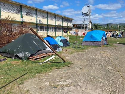 Tents housing several of the displaced residents at Petersfield High School in Westmoreland.