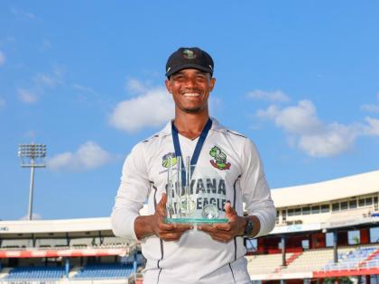 Guyana Harpy Eagles captain Tevin Imlach displays the West Indies Championship trophy his side won after their final game against the Trinidad and Tobago Red Force at Queen’s Park Oval on Saturday, April 12, 2025.