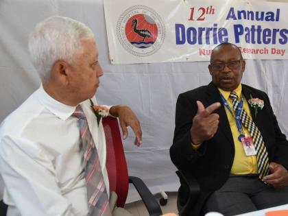 
Former chairman of the University Hospital of the West Indies Wayne Chai Chong (left) and CEO Fitzgerald Mitchell

