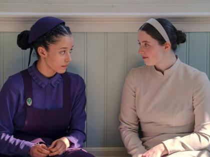 This image released by Disney shows Chase Infiniti (left), and Lucy Halliday in a scene from ‘The Testaments’. 