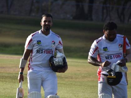 From left: Trinidad and Tobago’s Amir Jangoo and Terrance Hinds leave the pitch at Coolidge Cricket Ground in Antigua during their West Indies Championship game against the Leeward Islands Hurricanes on Monday. 