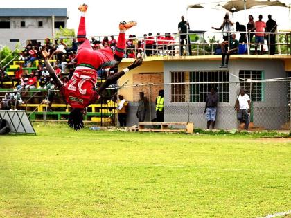 Montego Bay United’s Deonjay Brown somersaults as he celebrates scoring against Spanish Town Police FC during the Jamaica Premier League football game at Jarrett Park in Montego Bay on Sunday.