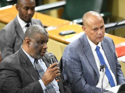 Errol Greene (left), permanent secretary in the Ministry of Health and Wellness, and Eric Hosin (right), acting chief executive officer at the University Hospital of the West Indies, during a sitting of Parliament’s Public Accounts Committee held on Apri