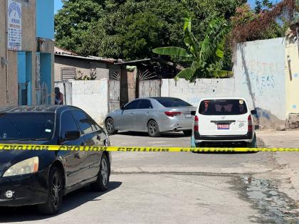 The open gates at premises where one of the men was killed.