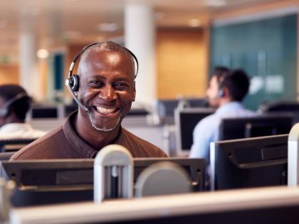 Representational image of a customer service executive interacting with a customer over the phone.