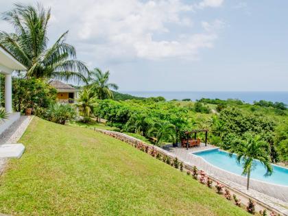 
The pool and pergola sit below the main house.