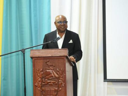 Tourism Minister Edmund Bartlett addressing students at the Jamaica Youth Tourism Summit and Artisan Experience in Montego Bay.