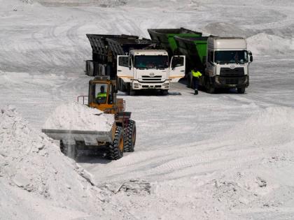 A front-end loader transports phosphogypsum in Phalaborwa, South Africa.