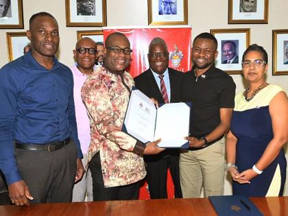 From left: Milton Dennis, estate manager, University of the West Indies (UWI), Mona Campus; Dr Ronald Robinson, consultant to the principal; Professor Densil A. Williams, pro vice‑chancellor and principal; Dr Peter Glegg, campus legal officer; Ockino Pet