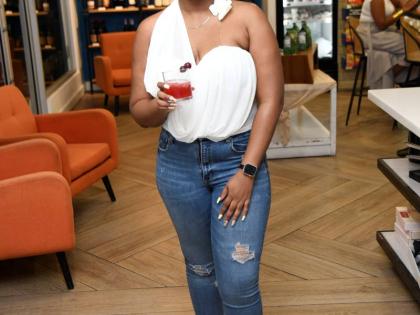With the Tennessee sling drink in hand, Kimberlee Rose, brand manager for wines and spirits at Caribbean Producers Jamaica, is all smiles for the camera.