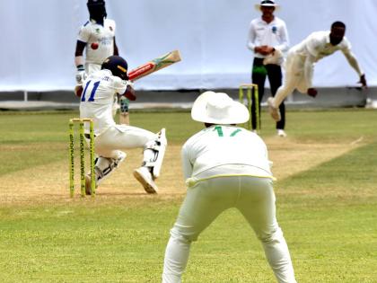 Barbados Pride captain Kraigg Brathwaite evades a sharp bouncer from Jamaica Scorpions fast bowler Ojay Shields on day two of their West Indies Championship match at Sabina Park yesterday.