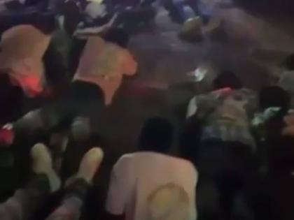 Patrons lay flat in a Mt James, St Andrew venue as directed by police. The lawmen swooped down on the venue in search of wanted men and illegal firearms.