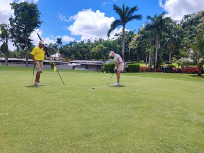 Maria Marta Iglesias Paz, captain, Buenos Aires’ San Jorge Golf Club, putts on hole six during Sunday’s All-Female Argentine Jamaica Tournament at Sandals Upton Golf and Country Club in St Mary. 