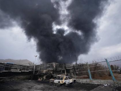 In this file photo, a thick plume of smoke rises from an oil storage facility hit by a US-Israeli strike in Tehran, Iran, on March 8, 2026. 