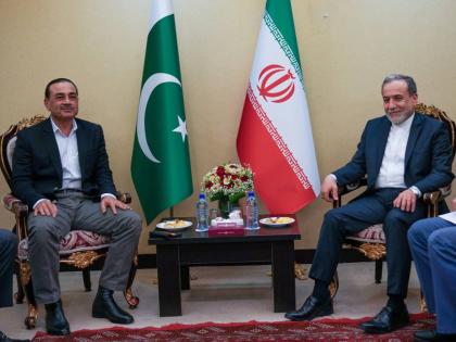 In this photo released by the Iranian Foreign Ministry, Iranian Foreign Minister Abbas Araghchi, right, meets with Pakistan's Army Chief Field Marshal General Asim Munir in Tehran.
