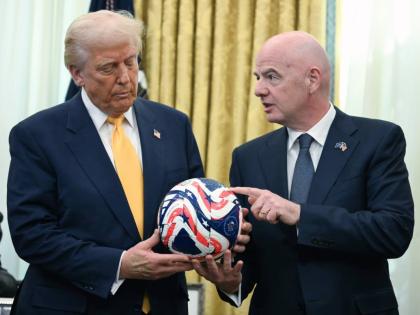  FIFA President Gianni Infantino, right, presents President Donald Trump with the new FIFA Club World Cup official ball in the Oval Office of the White House in Washington, March 7, 2025. (Jim Watson/Pool Photo via AP, file)
