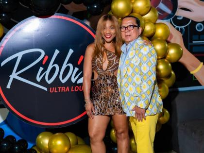 Man of the moment, Brian ‘Ribbie’ Chung, steps into the spotlight with his significant other, Roshani Howard, at his 67th birthday celebration at Ribbiz Ultra Lounge last  Thursday.