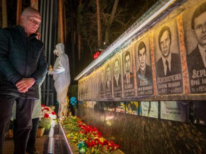 A man looks at a memorial dedicated to firefighters and workers who died after the 1986 Chornobyl (Chernobyl) nuclear disaster, ahead of its 40th anniversary in Slavutych, Ukraine. Chornobyl is the Ukrainian name for the city.
