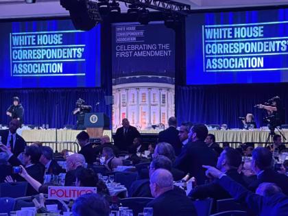 Members of the US Secret Service counter assault team stand on the stage after a shooting incident outside the ballroom during the White House Correspondents Dinner.