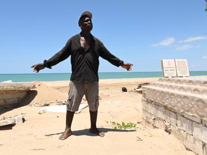 Michael Kelly shows two of the four graves that were damaged during the passage of Hurricane Melissa almost six months ago at Parottee in St Elizabeth last Wednesday.