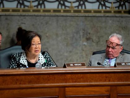 Senator Mazie Hirono, D-Hawaii, left, questions a witness as Senator Tim Kaine, D-Va., right, looks on during the Senate Committee on Armed Services hearing on Capitol Hill in Washington, Tuesday, April 28, 2026. (AP Photo/Cliff Owen)