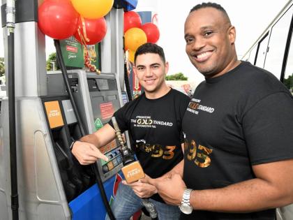 Fraser McConnell (left), Jamaican rally cross driver, and Jeremy Barnes, managing director of Fesco, at the launch of FESCO Futron 93 Octane Gold standard in automotive fuel at the FESCO station on Beechwood Avenue in Kingston on  Friday, December 9, 2022.