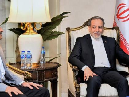 In this photo released by the Pakistan Foreign Ministry, Iran’s Foreign Minister Abbas Araghchi, right, meets with Pakistani Army Chief Field Marshal Asim Munir, left, upon his arrival at Nur Khan airbase in Rawalpindi, Pakistan, Friday, April 24, 2026. 