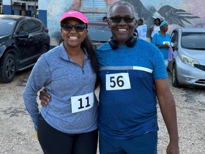 Williams-Singh and Custos Rotulorum of Manchester, Lt Col Garfield S. Green at New Forest High School’s 5K Run/Walk.