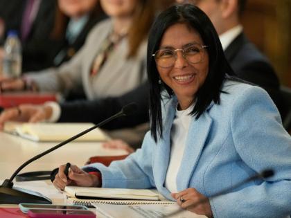 FILE - Venezuela's acting President Delcy Rodriguez smiles during a meeting with a delegation led by US Energy Secretary Chris Wright at Miraflores Palace in Caracas, Venezuela, February 11, 2026. 