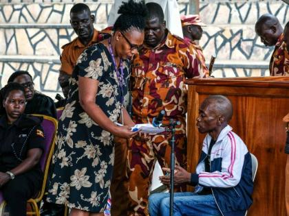 Christopher Okello Onyum, a man accused of killing four children, appears in court at the Ggaba Community Church grounds in Kampala, Uganda, Monday, April 13, 2026. 