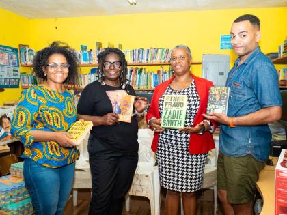 British actor, comedian, writer and musician Ben Bailey Smith (right) and his mother, Yvonne Bailey-Smith (second left) present a donation of books to Nichole Powell-Morgan, principal of St Mary’s Primary and Infant School, for use in the institution’s