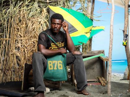 From left:Mr World Caribbean 2024 Tarique Barrett wears the 876 Black and Gold Mesh Jersey and poses with the 876 Green Mesh Tote Bag.