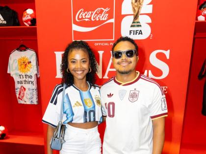Nico Lee and Mickala Simmonds show off their team colours at the Coca-Cola World Cup final experience.