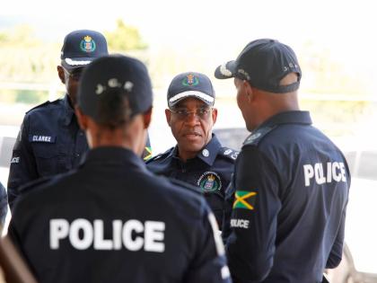 Police Commissioner Dr Kevin Blake (second right) and other police personnel in discussion at an Area One town hall held Wednesday at Area One headquarters in Montego Bay, St James.  