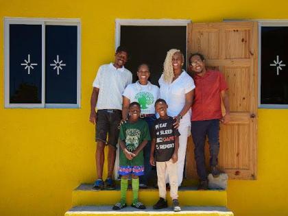 From left: Theodore Notise, the first recipient of a new home from the GrassROOTS Community Foundation, with Sabrina Webster, programme director, GrassROOTS Community Foundation; Dr Janice Johnson-Dias, pesident, GrassROOTS Community Foundation; Opposition