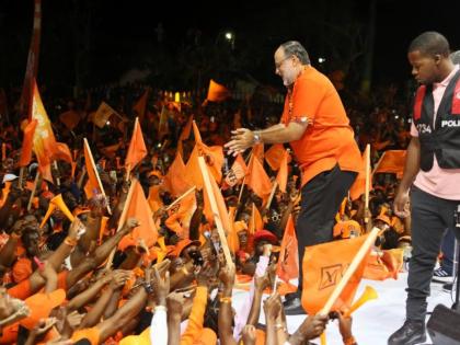 In this August 2025 photo Mark Golding is seen at a rally with PNP supporters.