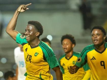 From left: Jamaica U20 players Brandon Bent (left) and Giovanni Taylor (right) celebrate the former’s last-minute goal during he Concacaf U20 Championship football game against Honduras on Sunday.