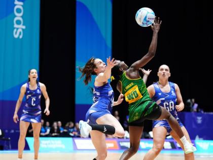 Iona Christian of Scotland (centre left) and Jodi-Ann Ward of Jamaica in action during the Netball Preliminary Round Pool B match at the Commonwealth Games in Glasgow, Scotland on Wednesday. Jamaica won 45-43.
