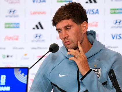 England’s John Stones listens during a news conference ahead of their third-place World Cup  match against France in Miami Gardens, Florida on July 18.