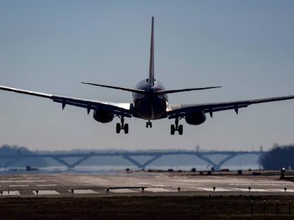 A plane lands at Ronald Reagan Washington National Airport in Arlington, Virginia, in 2022.