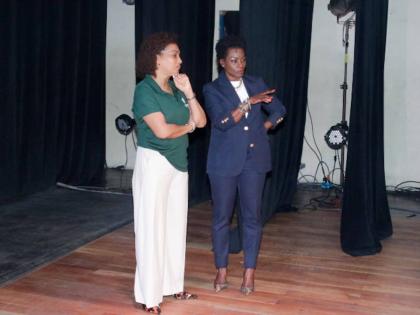 Heather Goldson (left), director, Supreme Ventures Foundation, and Marisa Benain, executive director of the Little Theatre, review the theatre’s stage during a recent visit to the facilities. 